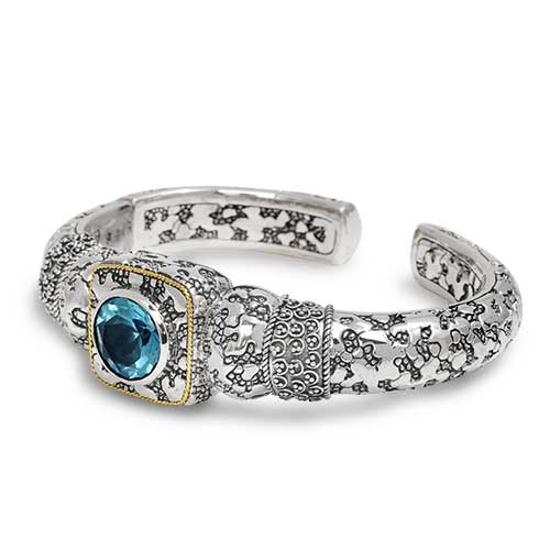 Gold & Silver bracelet kick cuff with Balinese Jawan setting with plaster motif. Set with Blue topaz Sky