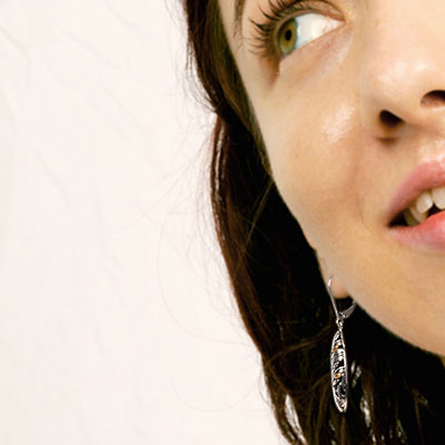 Silver hook earring with padi motif. Small version
